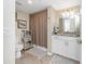 Cozy bathroom featuring tiled floors, shower and bath combo, and updated vanity at 14640 Sycamore Ct # 2812, Punta Gorda, FL 33955