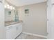 Bright bathroom featuring tiled floors and updated vanity at 14640 Sycamore Ct # 2812, Punta Gorda, FL 33955