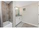 Bright bathroom featuring tiled floors, shower and bath combo, and updated vanity at 14640 Sycamore Ct # 2812, Punta Gorda, FL 33955