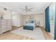 Bright bedroom features neutral walls, light wood floors and a ceiling fan at 14640 Sycamore Ct # 2812, Punta Gorda, FL 33955