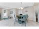 Cozy dining area with a wooden table and chairs, neutral walls, and a tiled floor at 14640 Sycamore Ct # 2812, Punta Gorda, FL 33955