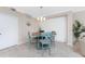 Charming dining room with tile flooring, a decorative clock, and an outdoor view at 14640 Sycamore Ct # 2812, Punta Gorda, FL 33955