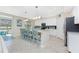 Eat-in kitchen with granite counters, an island, white cabinets, and stainless steel appliances at 14640 Sycamore Ct # 2812, Punta Gorda, FL 33955