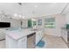 Bright, open-concept kitchen with stainless appliances and an island that has a sink and dishwasher at 14640 Sycamore Ct # 2812, Punta Gorda, FL 33955