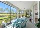 Inviting lanai offers picturesque views and features a stylish dining set for relaxing and entertaining at 14640 Sycamore Ct # 2812, Punta Gorda, FL 33955