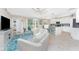 Bright living room with tiled flooring, a ceiling fan, and an open-concept design at 14640 Sycamore Ct # 2812, Punta Gorda, FL 33955