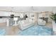 Open-concept living room and kitchen area with modern furniture and decor at 14640 Sycamore Ct # 2812, Punta Gorda, FL 33955