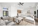 Bright living room featuring modern design elements with an open floor plan, connecting seamlessly to the kitchen and dining areas at 16440 Cape Horn Blvd, Punta Gorda, FL 33955