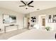 Bright main bedroom with ceiling fan and a view into the Primary bath at 16440 Cape Horn Blvd, Punta Gorda, FL 33955