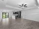 Large open living space showcasing tile floors, modern lighting, and an inviting open floorplan at 17331 Elmwood Ave, Port Charlotte, FL 33948