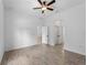Bedroom featuring multiple doors leading to other rooms, neutral paint and tile flooring at 17339 Elmwood Ave, Port Charlotte, FL 33948