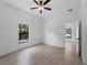 Bedroom featuring neutral paint, bright window view and tile flooring at 17339 Elmwood Ave, Port Charlotte, FL 33948
