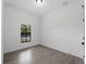 Bedroom with neutral paint, a small window, and light tile flooring at 17339 Elmwood Ave, Port Charlotte, FL 33948