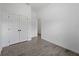 Bedroom featuring a closet, bright window and light tile flooring at 17339 Elmwood Ave, Port Charlotte, FL 33948