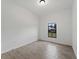 Bedroom with neutral paint, a small window, and light tile flooring at 17339 Elmwood Ave, Port Charlotte, FL 33948