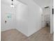 Inviting foyer features tile flooring, white walls, and access to additional rooms at 17339 Elmwood Ave, Port Charlotte, FL 33948