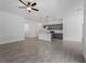 Bright open living space featuring modern kitchen island, recessed lighting, and tile flooring throughout at 17339 Elmwood Ave, Port Charlotte, FL 33948
