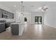 Open-concept living space with modern kitchen island, sleek cabinets, and contemporary finishes at 17339 Elmwood Ave, Port Charlotte, FL 33948
