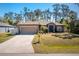 Charming single-story home with well-manicured lawn and two-car garage at 2084 Zuyder Ter, North Port, FL 34286