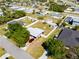 Aerial view of a neatly kept home with a big, fenced backyard and nearby trees at 209 Seminole Nw Blvd, Port Charlotte, FL 33952