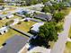 An aerial view of a fenced property in a well-maintained residential neighborhood at 209 Seminole Nw Blvd, Port Charlotte, FL 33952