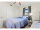 This bedroom features a ceiling fan, closet, and two windows at 209 Seminole Nw Blvd, Port Charlotte, FL 33952