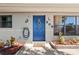 Close-up of a welcoming front door with decorative wreath and charming details at 209 Seminole Nw Blvd, Port Charlotte, FL 33952