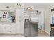 Functional kitchen with stainless steel refrigerator, ample storage and a modern design at 209 Seminole Nw Blvd, Port Charlotte, FL 33952