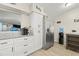Well-organized kitchen with plenty of counter space and a stainless steel refrigerator at 209 Seminole Nw Blvd, Port Charlotte, FL 33952