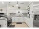 Stylish kitchen with white cabinetry, stainless steel appliances, and granite countertops at 209 Seminole Nw Blvd, Port Charlotte, FL 33952