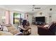 Comfortable living room showcasing tile flooring and a large window for natural light at 209 Seminole Nw Blvd, Port Charlotte, FL 33952