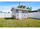 View of the detached storage shed in the backyard at 209 Seminole Nw Blvd, Port Charlotte, FL 33952