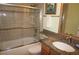 Bathroom featuring a shower and bathtub combination, granite countertops, and modern fixtures at 220 Coldeway Dr # 123, Punta Gorda, FL 33950