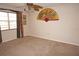 Bedroom featuring neutral carpet, a ceiling fan, and natural light from a window at 220 Coldeway Dr # 123, Punta Gorda, FL 33950