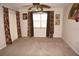 Spacious bedroom with neutral carpet, a large window, and decorative curtains at 220 Coldeway Dr # 123, Punta Gorda, FL 33950