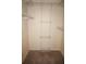 Walk-in closet with shelving system providing ample storage space at 220 Coldeway Dr # 123, Punta Gorda, FL 33950