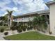 Inviting two-story condo building with lush landscaping, offering a serene and well-maintained living environment at 220 Coldeway Dr # 123, Punta Gorda, FL 33950