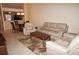 Spacious living room with tile floors, comfortable seating, and an open layout leading to the kitchen and dining area at 220 Coldeway Dr # 123, Punta Gorda, FL 33950