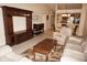 Inviting living room with tile flooring, comfortable white seating, neutral walls, and an open connection to dining area at 220 Coldeway Dr # 123, Punta Gorda, FL 33950
