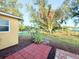 Manicured backyard showcasing lush greenery and mature trees, providing a tranquil outdoor space at 22299 Catherine Ave, Port Charlotte, FL 33952
