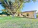 Beautiful backyard with mature trees, offering shade and privacy for outdoor enjoyment at 22299 Catherine Ave, Port Charlotte, FL 33952