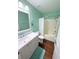Bright bathroom features a shower-tub combo and a vanity at 22299 Catherine Ave, Port Charlotte, FL 33952