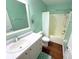Bright bathroom features a shower-tub combo and a vanity at 22299 Catherine Ave, Port Charlotte, FL 33952