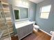 Bathroom featuring wood-look floors, stylish vanity, and a modern shower at 22299 Catherine Ave, Port Charlotte, FL 33952