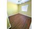 Bedroom with wood-look floors, a window, and natural light at 22299 Catherine Ave, Port Charlotte, FL 33952