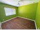 Bright bedroom with hardwood floors and large window at 22299 Catherine Ave, Port Charlotte, FL 33952