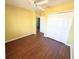 Bright bedroom with hardwood floors, ceiling fan, and closet at 22299 Catherine Ave, Port Charlotte, FL 33952