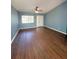 Open living room featuring beautiful wood floors, neutral walls, and natural light at 22299 Catherine Ave, Port Charlotte, FL 33952