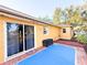Rear exterior with sliding doors to patio and an outdoor storage unit at 22299 Catherine Ave, Port Charlotte, FL 33952