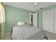 Cozy bedroom with light green walls, closet, and neutral carpet at 22385 Olean Blvd, Port Charlotte, FL 33952